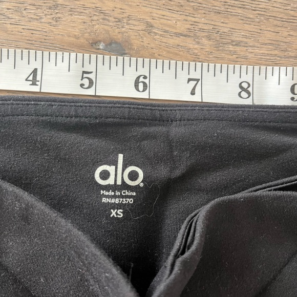 ALO YOGA Cropped Black Workout Leggings with Yellow Stripes - Picture 2 of 5